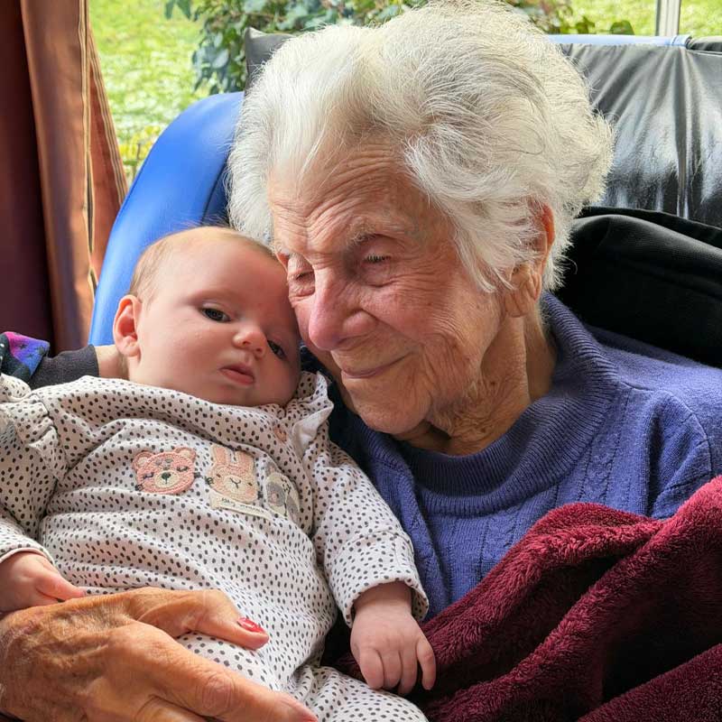 Resident holding baby